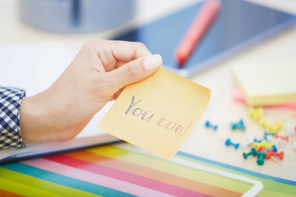 motivational sticky notes reflecting pressure to succeed in a sales role