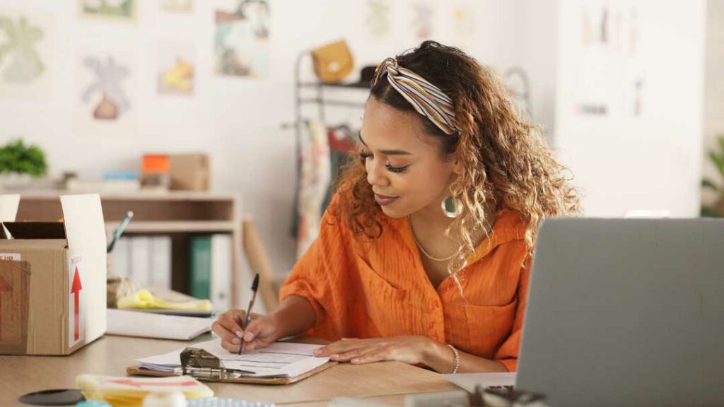 Woman working on her side hustle